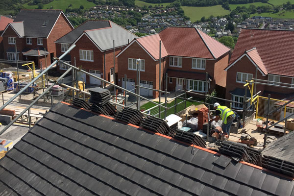 Roofing contractors working on new housing estate