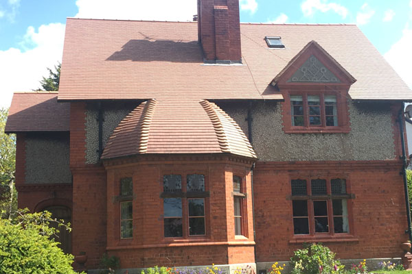 Roofer working at domestic property